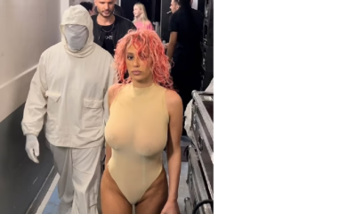 Kanye West's wife Bianca Censori debuts pink hair as she models a sheer nude thong leotard while the rapper dresses like a beekeeper in Paris
