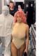 Kanye West's wife Bianca Censori debuts pink hair as she models a sheer nude thong leotard while the rapper dresses like a beekeeper in Paris