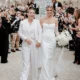 Lucy Spraggan breaks down in tears as Simon Cowell walks her down the aisle during her star-studded wedding to Emilia Smith