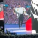 He's her No1 fan! Taylor Swift's Superbowl-winning fella Travis Kelce PERFORMS on stage with her at Wembley - carrying her across the stage then fanning her to the delight of the crowd