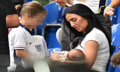 Annie Kilner feeds baby Rezon while cheering England from the stands after 'catching private jet to Germany'... as friends claim she is 'surrounded by love' from fellow WAGS
